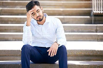 Buy stock photo Business man, stress and outdoor on stairs with a headache, depression or burnout in city. Young Indian male entrepreneur frustrated, anxiety or problem after being fired, unemployed or fail mistake