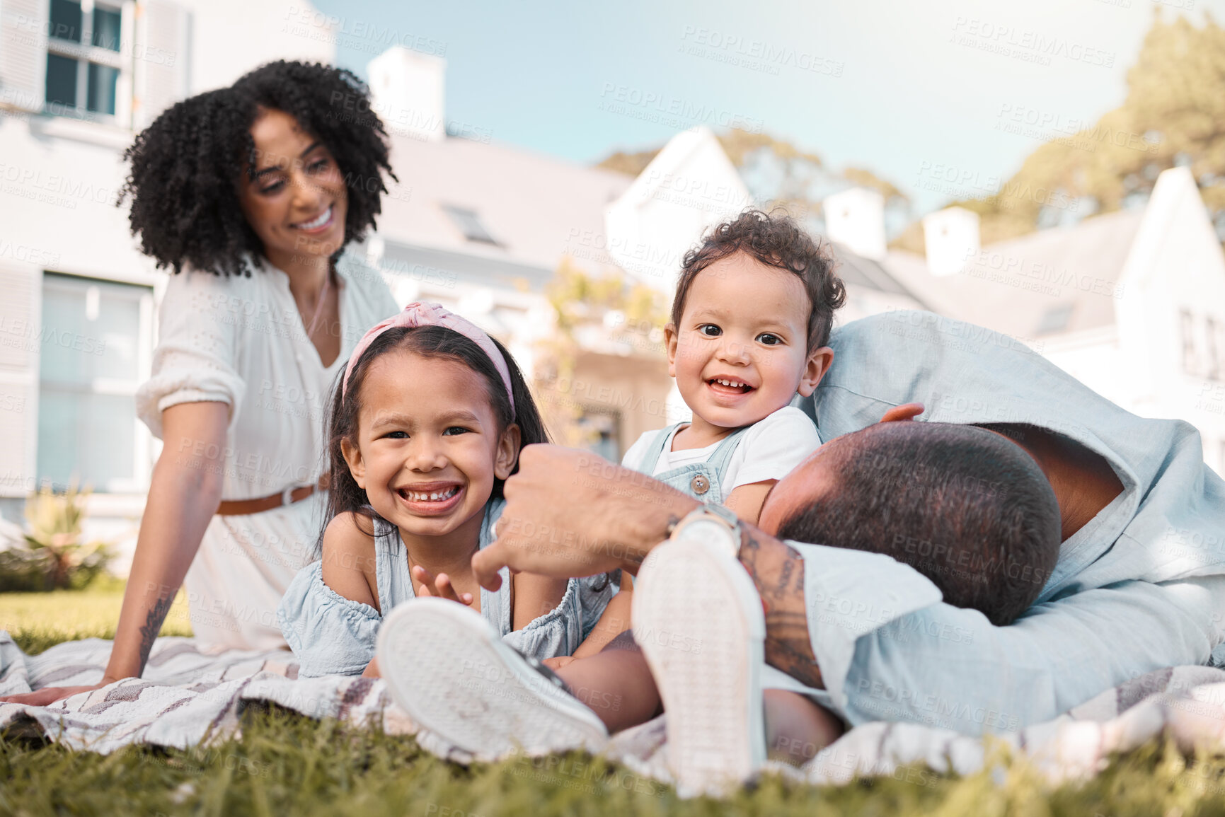Buy stock photo Love, blended family and parents on the lawn with their children in the garden of their home together. Mother, father and portrait of kids sitting on the grass in the yard of their house for bonding