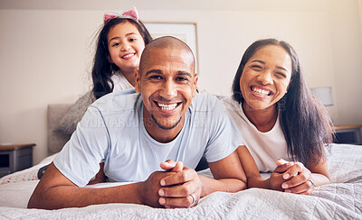 Buy stock photo Portrait, happy and a family relax on a bed at home while laughing and playing for quality time. Man, woman or hispanic parents and kid together in the bedroom for morning bonding with love and care