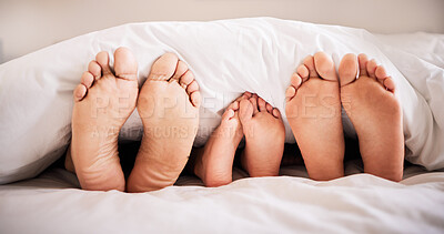 Buy stock photo Sleeping, feet and family in bed together in the morning, lying in a row to relax in their home. Mom, dad and child dreaming in a bedroom while bonding over the weekend for love, safety or insurance