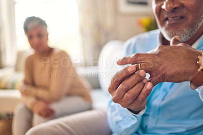 Buy stock photo Senior man, hands and ring in divorce, fight or conflict from disagreement or argument on sofa at home. Elderly couple in depression, infertility or cheating, mistake and toxic marriage in the house