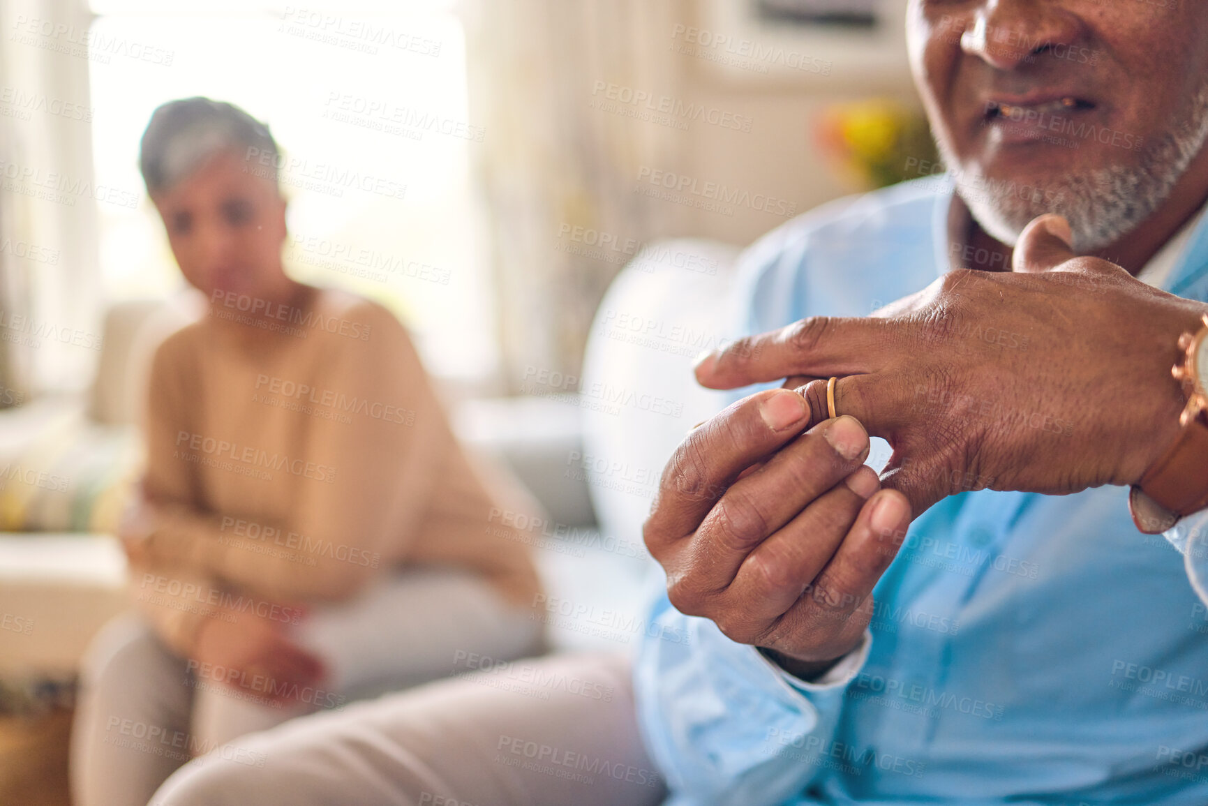 Buy stock photo Senior man, hands and ring in divorce, fight or conflict from disagreement or argument on sofa at home. Elderly couple in depression, infertility or cheating, mistake and toxic marriage in the house