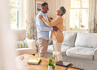 Buy stock photo Love, romance and dance with a senior couple in the living room of their home together for bonding. Marriage, retirement or bonding with an elderly man and woman dancing in the lounge of their house