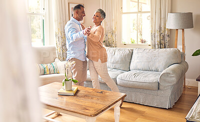 Buy stock photo Love, retirement and dance with a senior couple in the living room of their home together for bonding. Marriage, romance or bonding with an elderly man and woman dancing in the lounge of their house