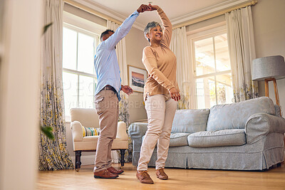 Buy stock photo Retirement, romance and dance with a senior couple in the living room of their home together for bonding. Marriage, love or fun with an elderly man and woman dancing in the lounge of their house