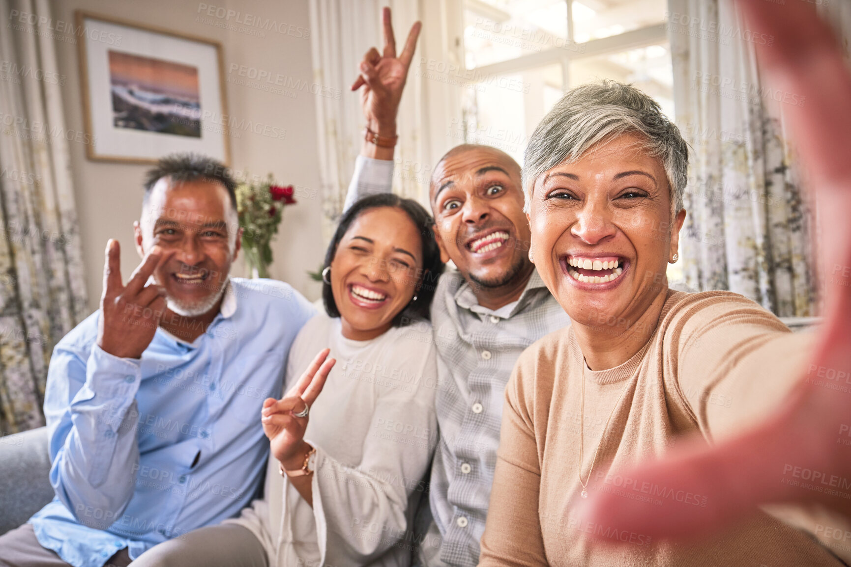 Buy stock photo Selfie, peace and funny face with a blended family on a sofa in the home living room together during a visit. Love, comic or comedy with senior parents and adult children in a house for a photograph