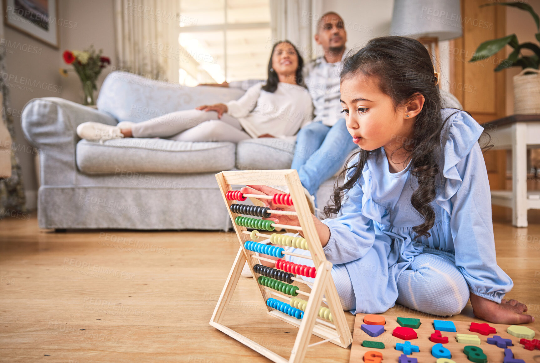 Buy stock photo Child, family home and learning with abacus on the floor or mom, dad and girl relax in living room with a game. Kid, development in math and toys for education and couple together on couch in house