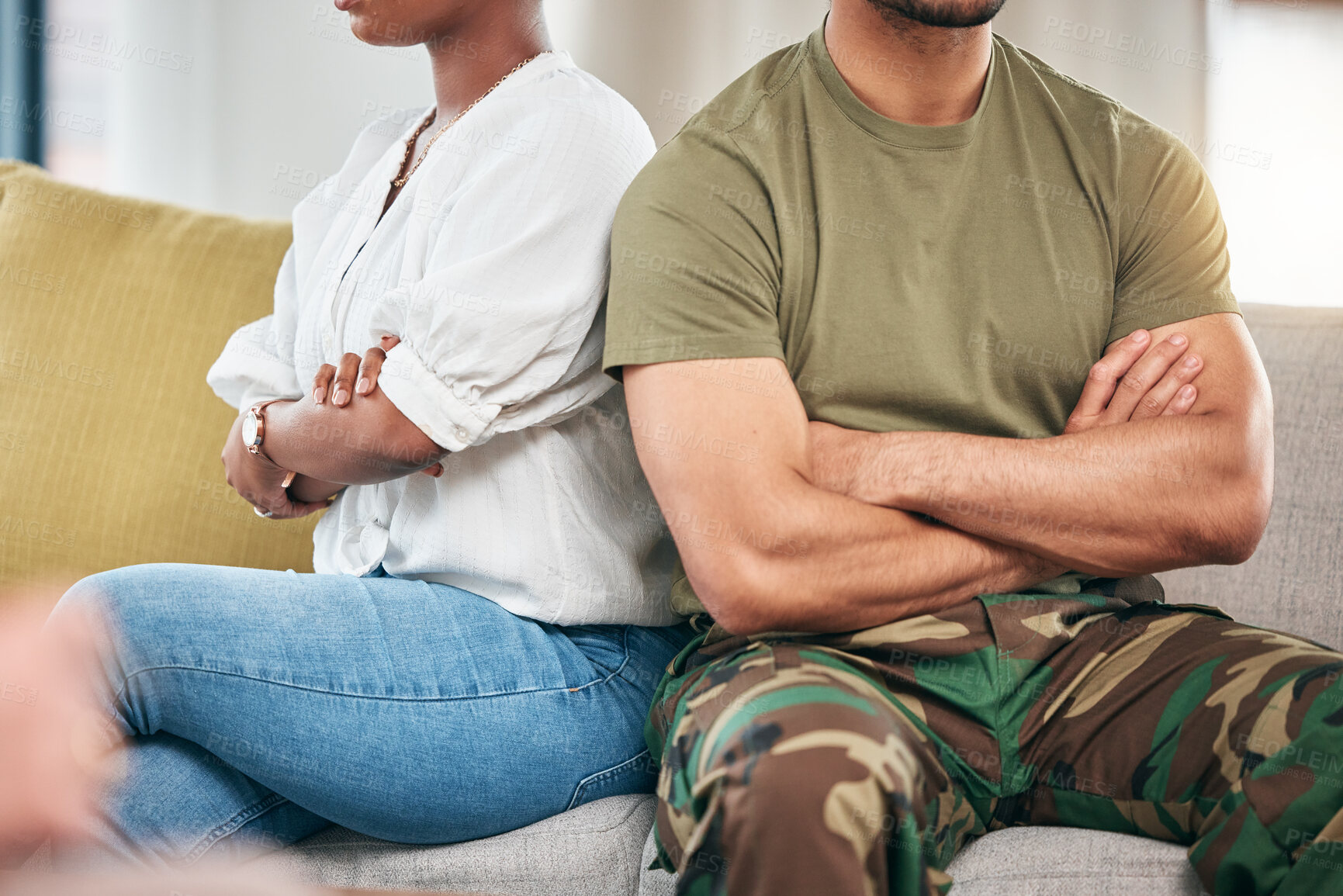 Buy stock photo Hands, fight and a couple with arms crossed on sofa in home living room. Angry, interracial divorce and a man and black woman with relationship problem, crisis or frustrated with marriage conflict.
