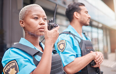 Buy stock photo Police, radio and patrol with a black woman officer outdoor on a city street for law enforcement. Walkie talkie, communication and a female security guard talking during crime prevention for safety