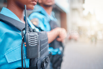 Buy stock photo Radio, police and surveillance with a black woman officer standing outside while on patrol in the city. Walkie talkie, dispatch or communication with a female security guard in an urban town