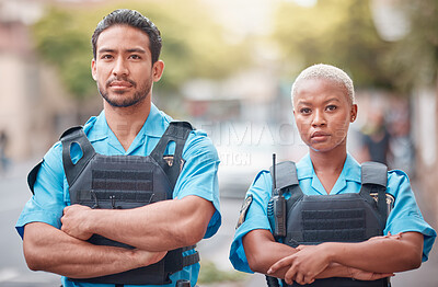 Buy stock photo People, police and arms crossed in city for law enforcement, safety and protection outdoors. Portrait of man and woman cop or security guard in teamwork to protect and serve the community in town