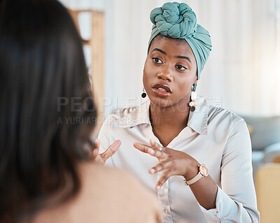 Buy stock photo Conversation, business people and meeting or interview in office with a black woman as leader. A serious African female entrepreneur with employee talking for advice, idea or communication at work