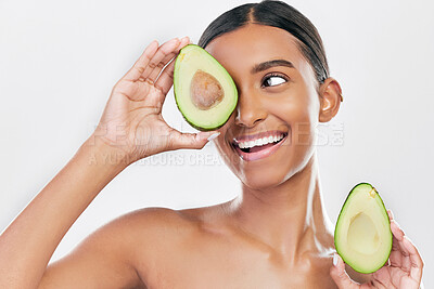 Buy stock photo Avocado, skincare and happy, beauty woman isolated on a white background for healthy facial and cosmetics ideas. Indian woman or model thinking of vegan, eco friendly or dermatology product in studio