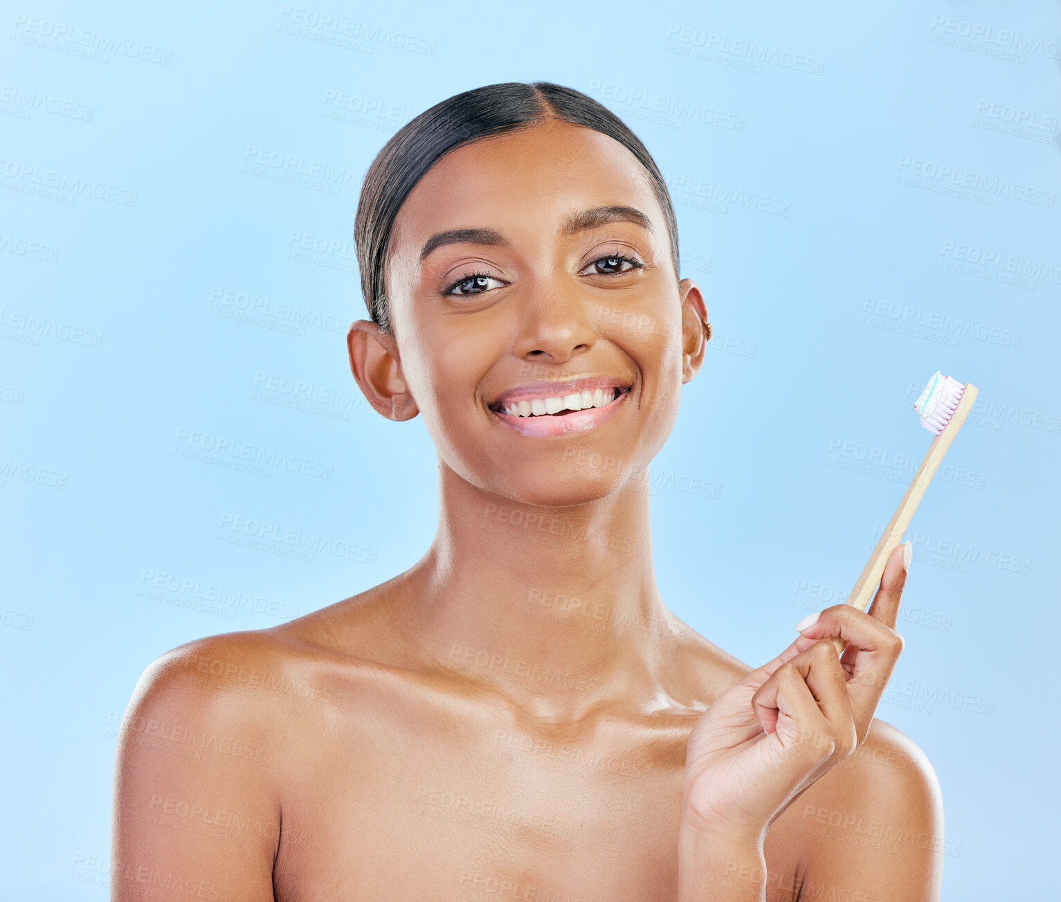Buy stock photo Toothbrush, portrait and a woman brushing teeth for dental health on a blue background for wellness. Happy indian female model with toothpaste and brush for a clean, fresh and healthy mouth in studio