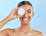 Cream, container and beauty, woman with skincare and cosmetics product isolated on blue background. Lotion on face, sunscreen and facial mask, smile and moisturizer with female model and dermatology