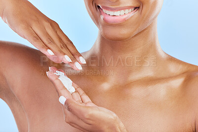 Buy stock photo Closeup, woman and cosmetics with cream, dermatology and self care against a blue studio background. Zoom, female person and model with lotion, grooming and natural beauty with skincare and wellness