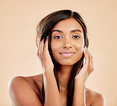 Buy stock photo Hair, beauty and portrait of a woman in studio with natural glow and shine. Hairstyle, cosmetics and wellness of a happy Indian person for self care, makeup or salon results on a beige background