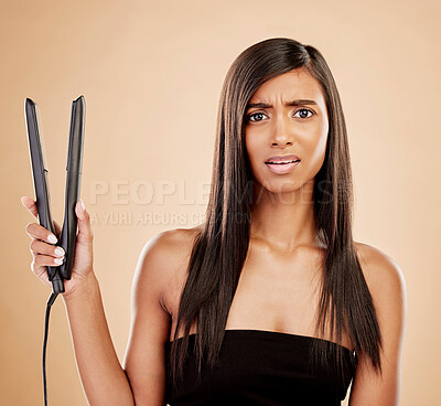 Buy stock photo Flat iron, hair and woman is confused with beauty, hairstyle and appliance fail on studio background. Keratin treatment, problem with electric straightener and female model with haircare crisis