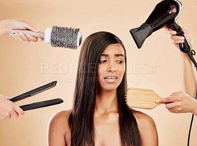 Buy stock photo Hair, electric tools and damage of woman for beauty, heat treatment and stress on studio background. Indian female model, worry and anxiety for aesthetic equipment of brush, hairdryer and flat iron 