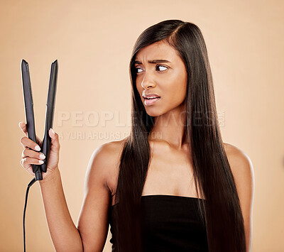 Buy stock photo Hair straightener, woman is scared and beauty, hairstyle and appliance fail on studio background. Keratin treatment, problem with electric flat iron and female model, haircare crisis and treatment