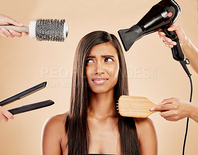 Buy stock photo Hair, tools and worry of woman with product for beauty, heat treatment and unhappy on studio background. Indian female model, stress and anxiety for brush, hairdryer and flat iron styling equipment