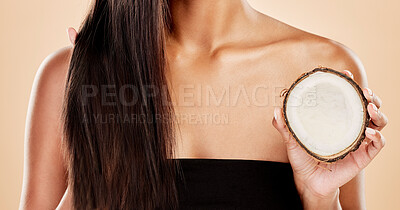 Buy stock photo Closeup, woman or coconut of hair, beauty or cosmetic treatment for natural growth, sustainable cosmetics or studio background. Female model, tropical fruits or vegan dermatology of healthy hairstyle