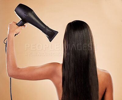 Buy stock photo Hair, beauty and back view, woman with hairdryer and keratin treatment with heat on studio background. Female model, cosmetics and haircare with salon hairstyle, equipment and blow dry with shine