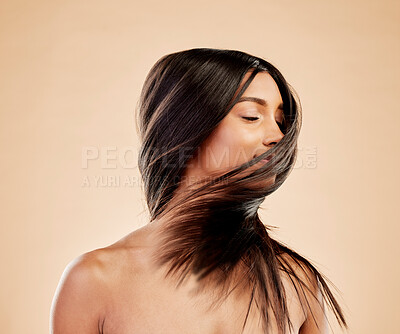 Buy stock photo Woman, shake hair and beauty with growth, texture and shine with natural cosmetics on studio background. Indian female model, satisfied with salon treatment and Brazilian, hairstyle and haircare