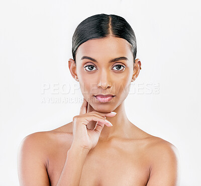 Buy stock photo Beauty, face and portrait of serious woman with natural skincare isolated on a white background. Dermatology, makeup glow or cosmetics with Indian female model for facial shine or self love in studio