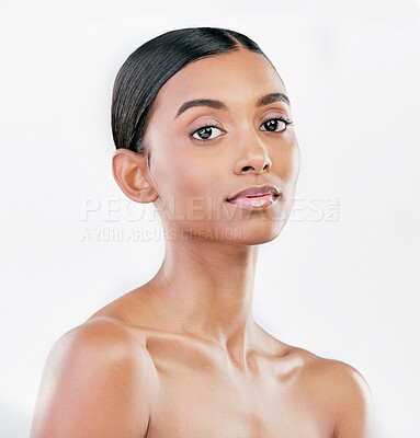 Buy stock photo Beauty, face and portrait a woman with natural skin care on a blue background with cosmetics. Dermatology, makeup glow and Indian female model for facial shine, wellness and self love in studio