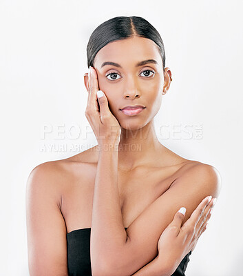 Buy stock photo Beauty, hand on face and portrait a Indian woman with natural skincare isolated on a white background. Dermatology, makeup glow and cosmetics with female model for facial shine or self care in studio