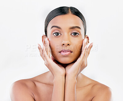 Buy stock photo Beauty, portrait and a woman with hands on face for natural skincare isolated on a white background. Dermatology, makeup glow and cosmetics with a serious Indian person for facial shine and self care