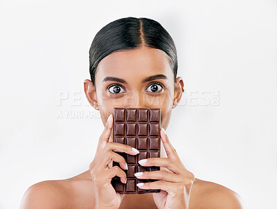 Buy stock photo Woman, portrait and chocolate in sweet diet or unhealthy eating against a white studio background. Female person or model with cocoa slab, block or bar in delicious treat, snack or diabetes on mockup