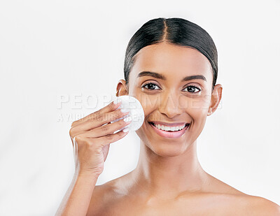 Buy stock photo Woman, face and cotton pad, beauty and makeup remover with skincare isolated on white background. Smile, portrait and dermatology, skin health and glow with young female model and clean facial 