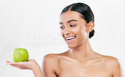 Buy stock photo Beauty, woman and apple in hands for skincare and natural glow isolated on white background. Dermatology, health and wellness of Indian person with facial, benefits and fruit for self care in studio