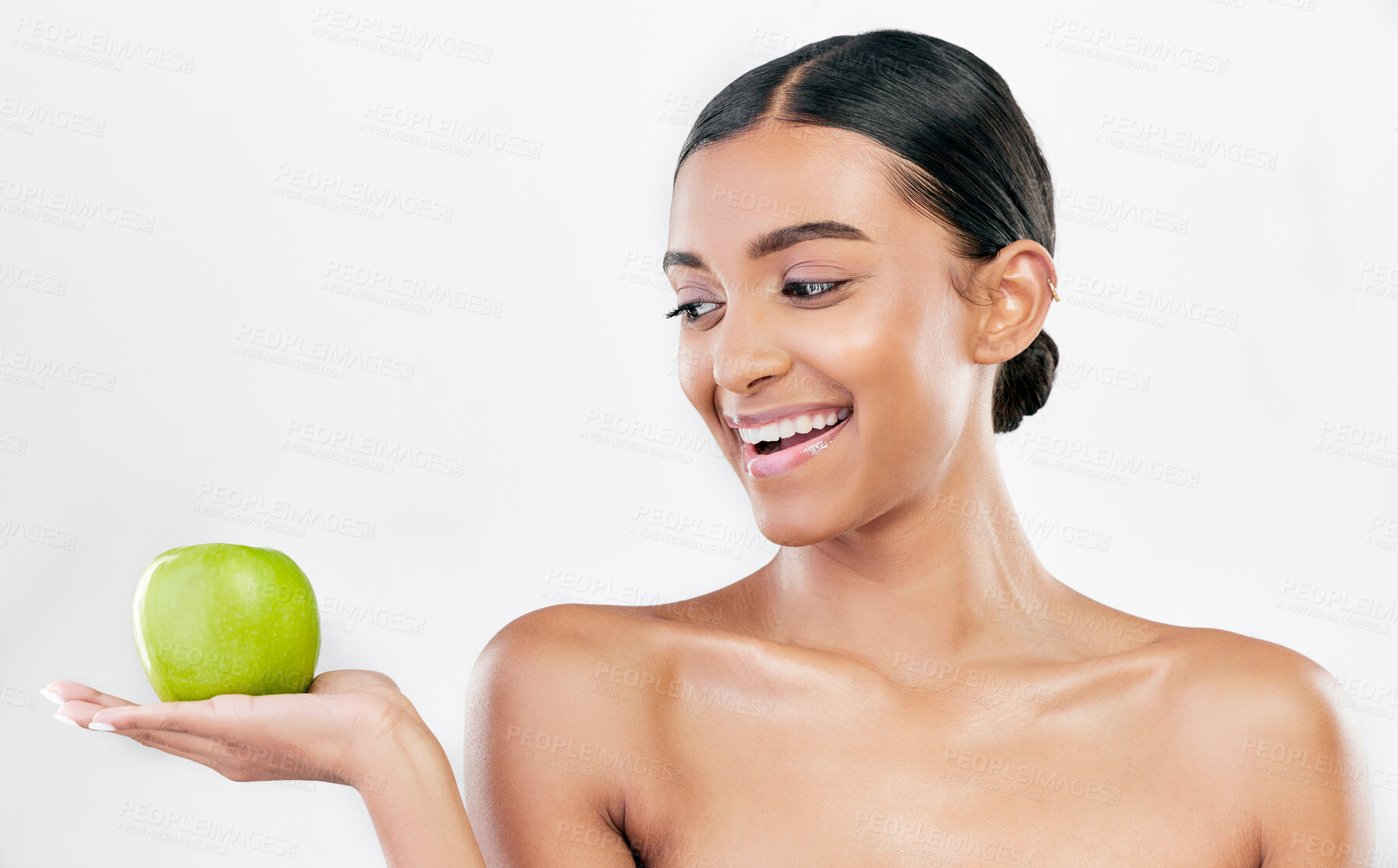 Buy stock photo Beauty, woman and apple in hands for skincare and natural glow isolated on white background. Dermatology, health and wellness of Indian person with facial, benefits and fruit for self care in studio