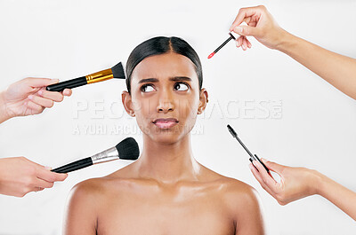 Buy stock photo Makeup, brush and confused woman with beauty shine, overwhelmed with beautician on white background. Anxiety with cosmetics, tools and hands crowd female model in studio, cosmetology and skin glow