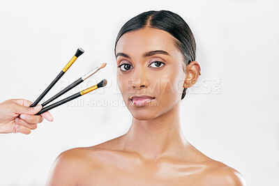 Buy stock photo Portrait, woman and makeup brush set for face, cosmetics or aesthetic tools on white background in studio. Indian female model, facial beauty product or collection of foundation, skincare or makeover
