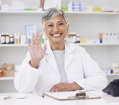 Buy stock photo Pharmacist, portrait and hand of woman for hello at pharmacy counter for friendly service with a smile. Mature female employee in healthcare, pharmaceutical and medical industry for medicine retail