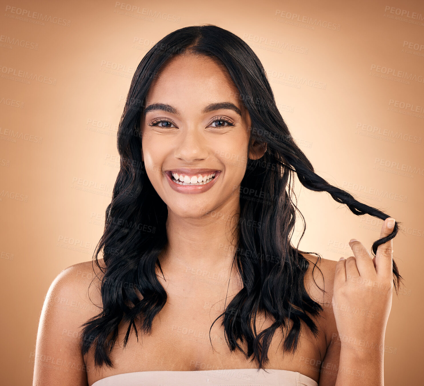 Buy stock photo Portrait, hair and beauty with a model woman in studio on a brown background for shampoo treatment. Smile, salon and haircare with a happy young person looking confident about natural cosmetics