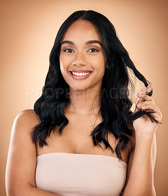 Buy stock photo Portrait, hair and aesthetic with a model woman in studio on a brown background for shampoo treatment. Beauty, salon and smile with a confident young person looking natural after cosmetic haircare