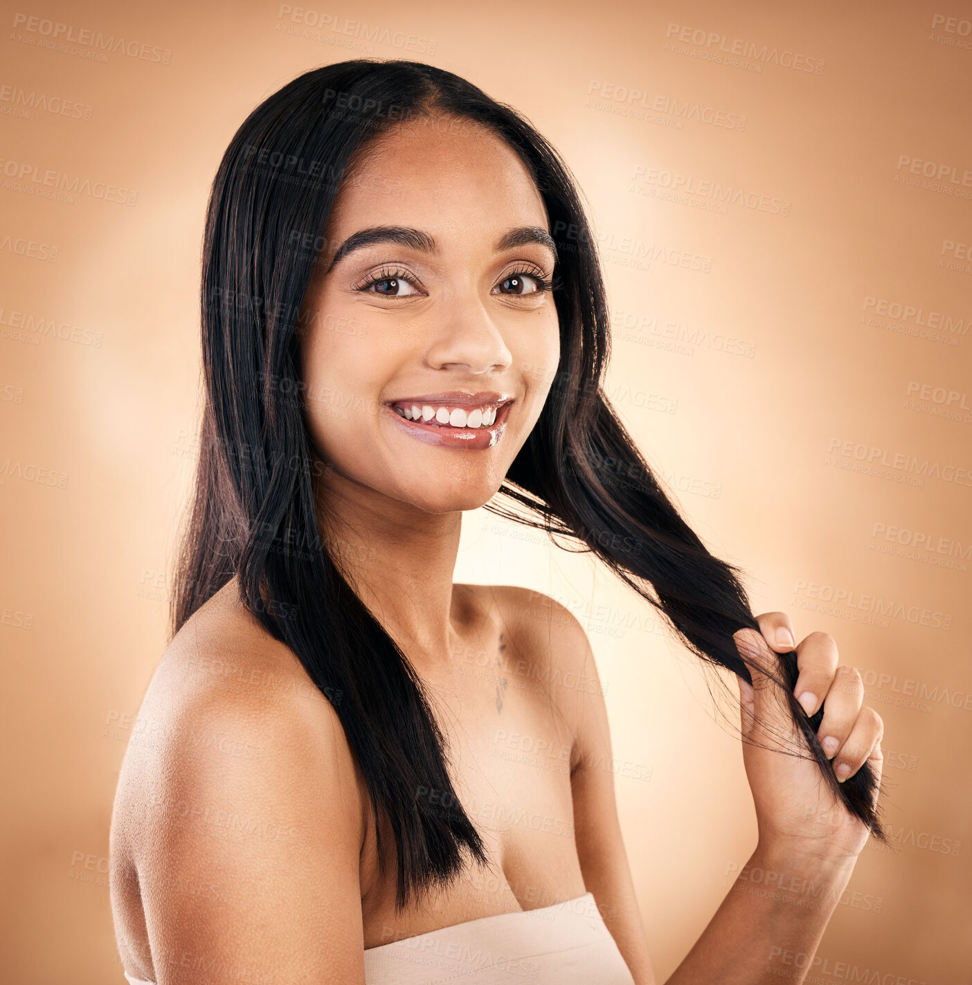 Buy stock photo Portrait, hair and shampoo with a model woman in studio on a brown background for keratin treatment. Face, salon and smile with a happy young person looking confident about haircare cosmetics