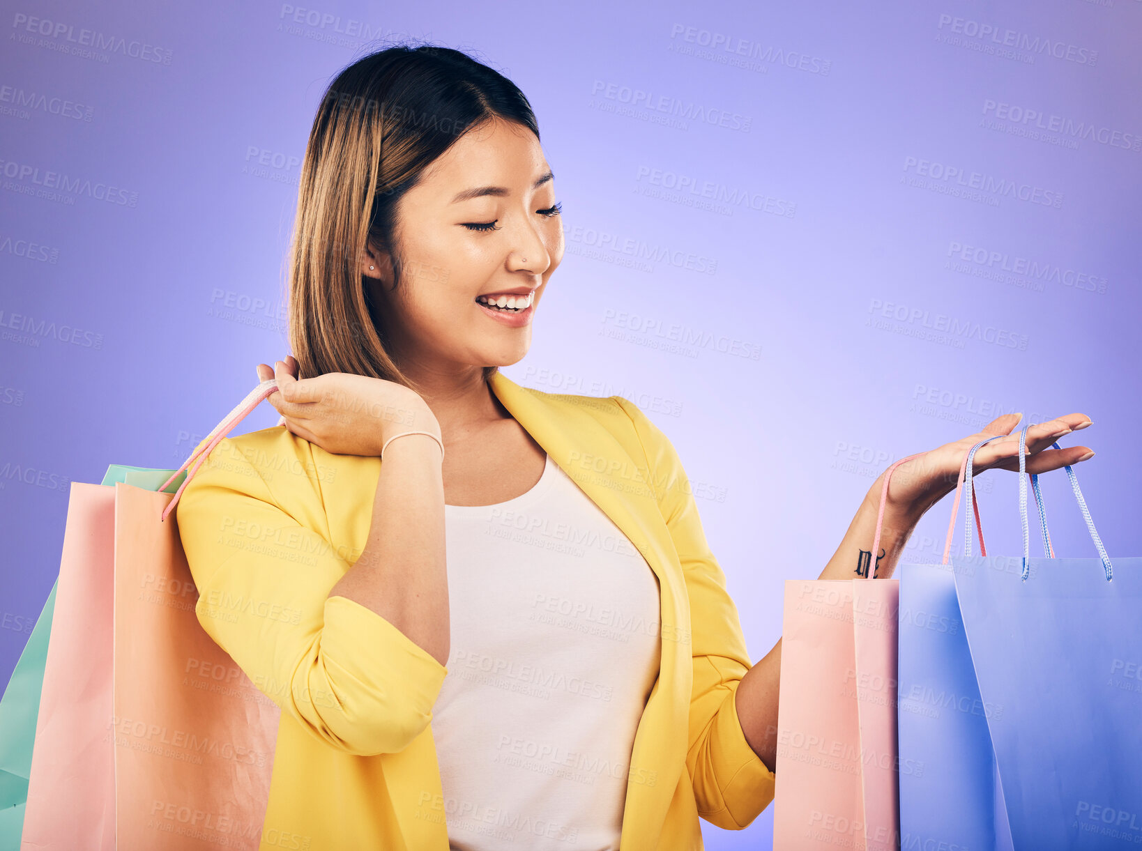 Buy stock photo Happy, face and woman with shopping bag from a sale, promotion or customer with deal on retail clothing. Asian model, shop for fashion and discount at market, mall or commercial store mockup