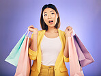 Surprise, wow and portrait of woman with shopping bag from a sale, promotion or customer with deal on retail clothing. Face, Asian model with shock, emoji or crazy discount on luxury product or store