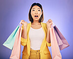 Wow, surprise and portrait of woman with shopping bag from a sale, promotion or customer with deal on retail clothing. Face, Asian model with shock, emoji or crazy discount on luxury product or store