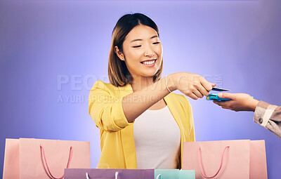 Buy stock photo Card machine, shopping bag and woman POS, online payment and digital service or fashion fintech. Retail credit and cashier hands, asian customer or people at point of sale on studio purple background