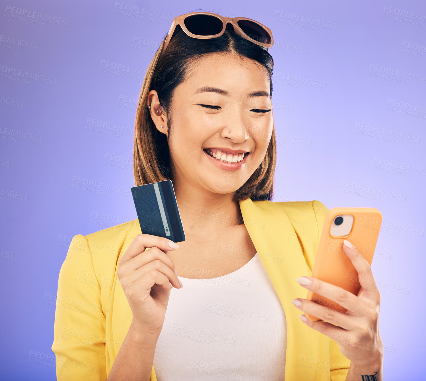 Buy stock photo Woman, phone and credit card of e commerce, online shopping or fintech payment on studio purple background. Fashion sale and happy asian person on internet banking, subscription or mobile transaction