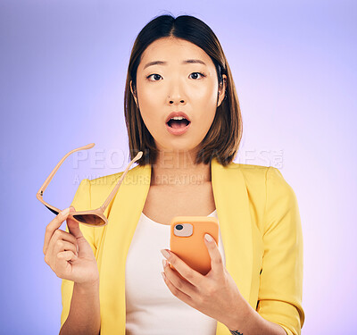 Buy stock photo Phone, asian and portrait of woman surprise for online shopping discount, fashion deal or cellphone announcement. Smartphone notification, studio update or face of shocked person on purple background