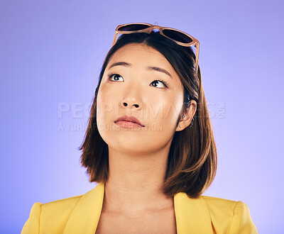 Buy stock photo Thinking, woman and face with sunglasses for fashion, idea or think of summer holiday on purple studio background. Choice, decision and Asian model with glasses on head with cool gen z style