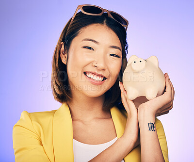 Buy stock photo Piggy bank, finance portrait and woman with savings, investment and happy for budget insurance. Young asian person for financial management, money safe or banking security on studio purple background